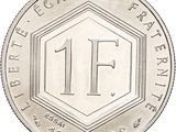 an image of a silver coin with the number 11 on it