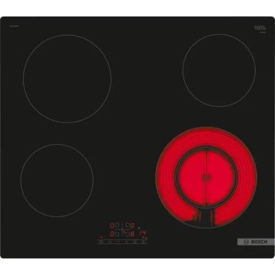 une image représentant une plaque de cuisson noire et rouge à trois feux