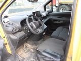 a yellow truck with a steering wheel and a black seat