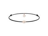 un bracelet en cordon noir orné d'un diamant taille rose et d'un diamant taille rose