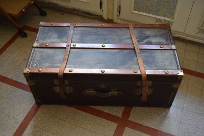 an old suitcase sitting on the floor in a room