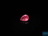 a pink diamond on a black background