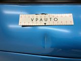 a sticker that says vauto on the back of a blue car
