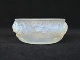 a close up of a glass bowl on a black surface