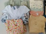 a lot of clothes that are sitting on a table