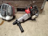 two tools that are sitting on the floor next to each other