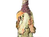 a figurine of a woman with a bird on her head