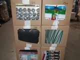 a cardboard cart with many items on it in a warehouse