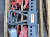 a box full of tools that are sitting on the floor