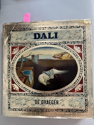a picture of a book with a picture of dali on it