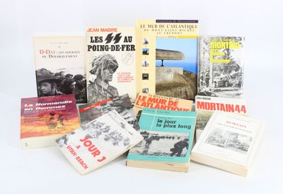 several books are stacked on top of each other on a white surface
