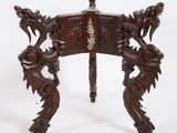 an image of a wooden table with a dragon design on it