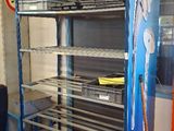 a metal rack with a bunch of items on it