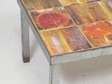 a coffee table with a colorful tile design on it