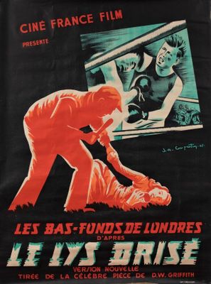une affiche noire et rouge représentant un homme tenant un bébé dans ses bras