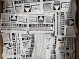 a box with a lot of newspapers on it