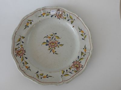a plate with a floral design on it on a table