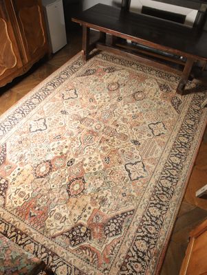 a rug on the floor in a living room