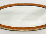 a mirror that is sitting on a white surface
