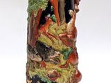 a beer mug with a picture of a man and a woman in a forest