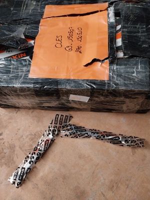 a box with a pair of scissors sitting on the floor