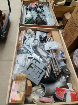 two boxes of assorted items sitting on the floor