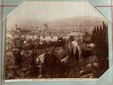an old photo of a view of a city from the top of a hill