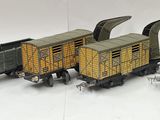 several toy trains are lined up on a white surface