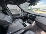 a view of a car ' s interior from the driver ' s seat