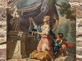 une peinture accrochée au mur d'un immeuble représentant une femme et un enfant