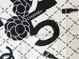 chanel black and white scarf with chanel logo on it