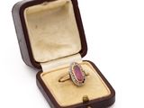 an image of a ring in a box on a white background