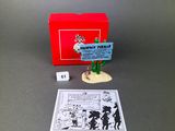 an image of a box with a toy figure and a card