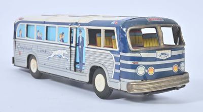 a blue and white bus that is on a white surface
