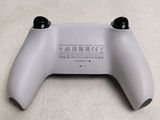 a close up of a wii controller on a table