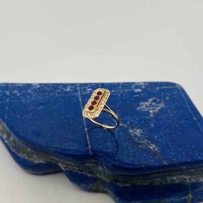 a close up of a blue stone with a ring on top of it