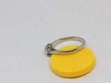 a ring that is sitting on top of a yellow sponge