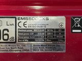 a close up of a red fire hydrant with stickers on it