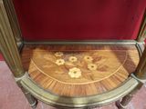 a wooden table with a flower design on it