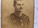 an old photo of a man in uniform with a mustache and moustache