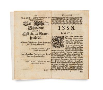 an old book with a black and white image on it