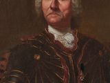 portrait of a man in armor with a sword in his hand