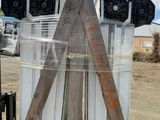 a large pile of wood sticks and other items on a pallet