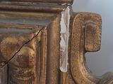 a close up of a mirror with a bird on it