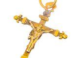 gold plated crucift with a cross on a white background