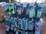 many pairs of gloves on display in a store