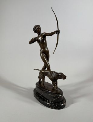 an image of a bronze statue of a woman with a bow and a dog