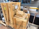 many wooden boxes stacked on a pallet in a warehouse