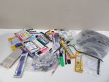 a pile of school supplies sitting on a white table