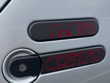 a close up of a car ' s door handle with the numbers on it